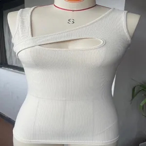 Detailed view of white ribbed sleeveless tank top featuring a sexy front cutout design