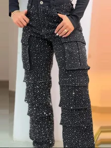 Women's high waist black denim wide leg cargo pants with sparkling rhinestone accents.