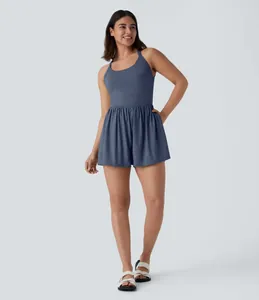 Chic sleeveless halter neck romper in dusty blue, perfect for active summer days