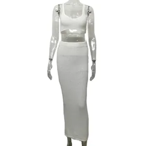 Chic white knit two-piece set featuring sleeveless crop top and bodycon maxi skirt for women