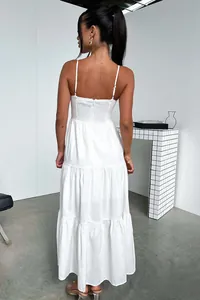 Back view of elegant white tiered maxi dress with thin adjustable straps