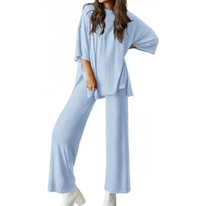 Light blue women's two-piece lounge set with loose short-sleeve top and wide-leg pants