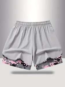 Detailed view of women's 2-in-1 sports shorts with pink pixel camouflage inner layer