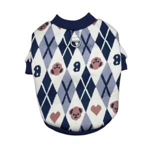 Detail view of knitted dog sweater with argyle bear pattern and metal D-ring attachment