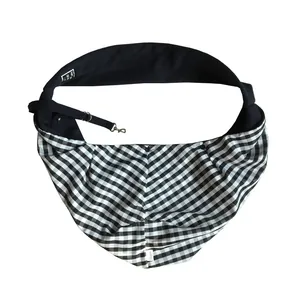 Close-up of a black and white checkered pet sling carrier bag for cats and small dogs