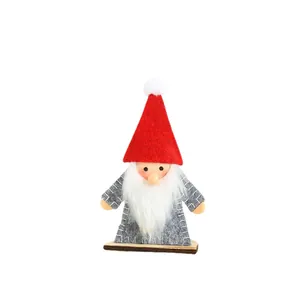 Handcrafted wooden Christmas gnome figurine with red felt hat and fluffy white beard