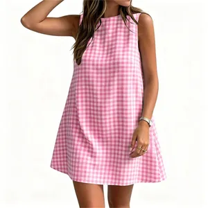 Detail shot of the pink and white gingham pattern on a sleeveless summer mini dress.