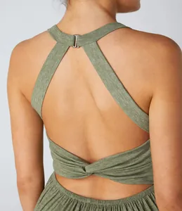 Detailed back view of a green halter neck jumpsuit featuring a stylish twisted knot