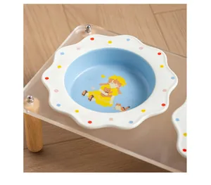 Detail view of colorful polka dot ceramic pet bowl on a clear acrylic stand with wooden legs