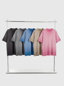 Retro distressed washed cotton T-shirts in five colors hanging on a rack