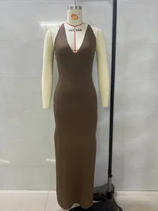 Detailed view of a brown knitted V-neck maxi dress on a mannequin