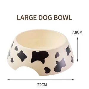 Detail view of large cow print melamine pet bowl, 22cm diameter and 7.8cm height