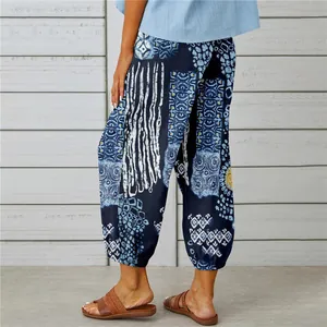 Detail of vintage print cotton linen cuffed trousers with elastic high waist