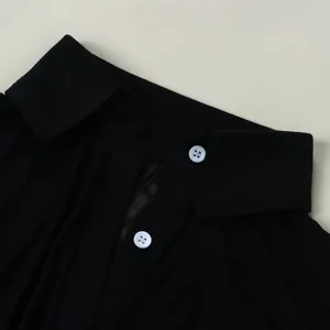 Macro view showing the black mesh fabric texture and white buttons on the polo collar