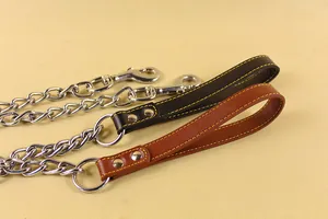 Close-up detail of metal dog leash chain with reinforced leather handles in black and brown