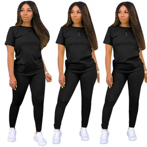 Three women models in black round neck t-shirt and matching leggings two piece set