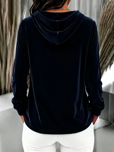 Back view of a navy blue velvet hooded sweatshirt with a loose fit and soft texture