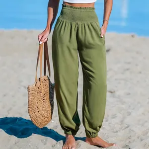 Women's olive green loose high-waist beach joggers with elastic waist and ankles.