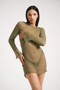 Detailed view of an olive green sheer knitted beach cover-up dress with long sleeves.