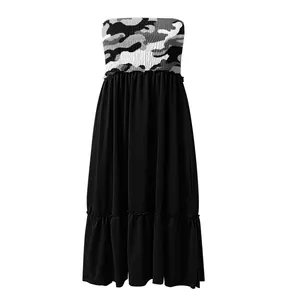 Detail of camouflage print and smocked bodice on a strapless midi dress for women