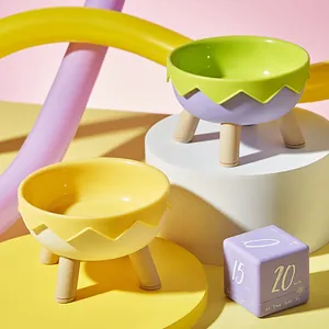Modern elevated neck protection pet bowls with wooden legs in vibrant colorful design
