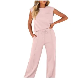 Full view detail of a pink two-piece set featuring a sleeveless top and wide-leg pants