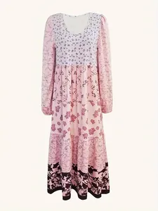 Detail view of the floral print long sleeve maxi dress with tiered skirt design.