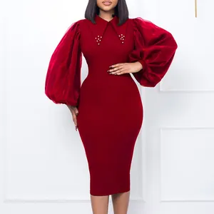 Close-up showing the mesh puff sleeves and beaded collar detail of this red midi pencil dress