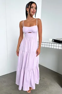 Elegant lavender maxi dress detail featuring a chic cut-out waist and tiered skirt
