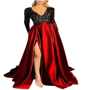 Detail view of a long-sleeved sequin V-neck evening gown with a high-slit red skirt