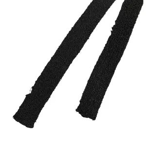 Macro view showing the textured black fabric straps of a slim-fit holiday dress