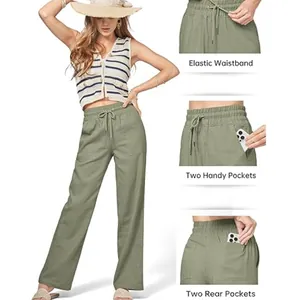 Detailed view of women's olive green wide-leg linen pants with pockets and elastic waist