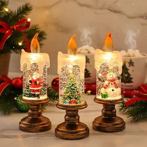 Set van drie prachtige kerst sneeuwbol LED kaarsen met kerstman en een sneeuwpop