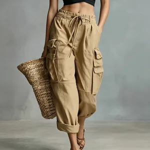 Close-up detail of women's khaki cargo pants featuring functional utility pockets.