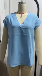 Detail view of women's light blue V-neck short sleeve pullover blouse on mannequin torso