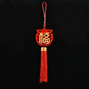 Traditional Chinese New Year hanging ornament made of red felt with gold Fu character