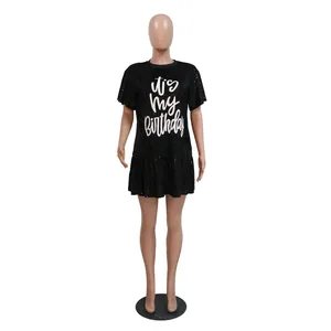 Front view of elegant black sequin short sleeve birthday dress with ruffled hem