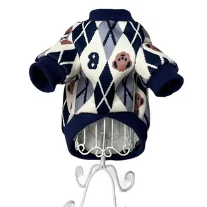 Detailed view of winter pet sweater featuring argyle pattern and bear motifs