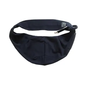 Close-up of navy blue pet sling carrier with safety hook and designer label