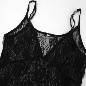 Detail of intricate black lace texture on a sexy V-neck slip dress for summer wear