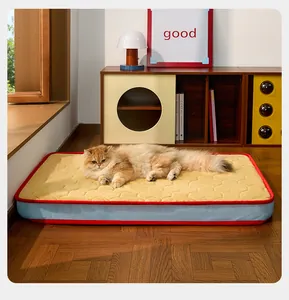 Long-haired cat resting on a yellow quilted pet mattress with breathable mesh sides.