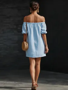 Full back view of a light blue off-shoulder cotton linen summer dress with a loose fit