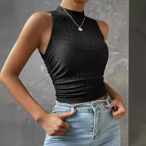 Close-up detail of black mesh jacquard fabric on a slim fit mock neck sleeveless crop top