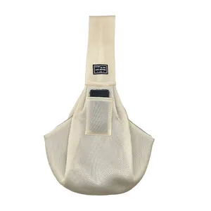 Detail view of breathable mesh pet carrier bag with convenient phone pocket