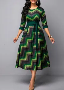 Elegant green chevron print midi dress with high waist tie and three-quarter sleeves
