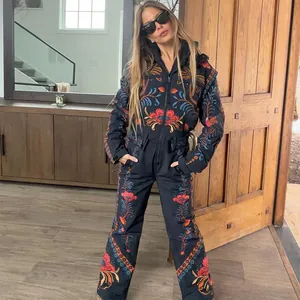 Detailed full view of women's retro floral embroidery ski jumpsuit with hooded design