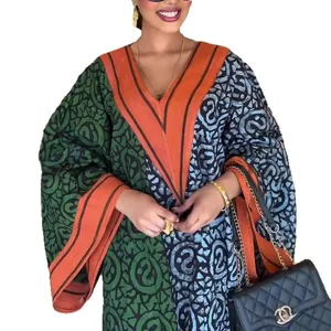 Elegant V-neck long-sleeve maxi dress featuring vibrant geometric prints and color blocking
