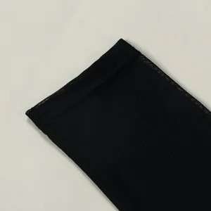 Macro view of black sheer mesh fabric detail showing the delicate woven texture