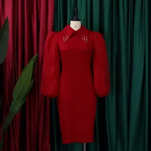 Close-up of red bodycon dress featuring mesh puff sleeves and pearl-beaded collar detail.