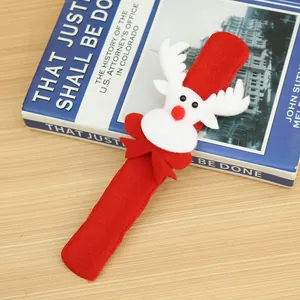 Close-up of a festive red Christmas slap bracelet with a plush reindeer design.